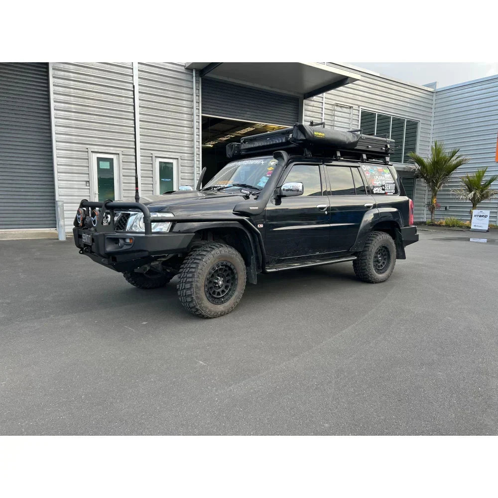 Black rockarmor brushbar on nissan patrol gu4 with roof tent suited for gt bullbar off-road protection