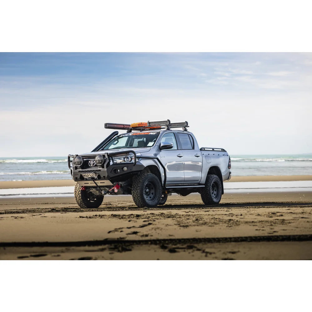 Silver off-road Toyota pickup truck with Rockarmor GT Hoop Steel Bullbar on Hilux N80