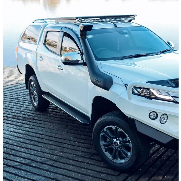 White Mitsubishi Triton with snorkel and roof rack featuring rockarmor steel rockslider checker plate side steps rear view